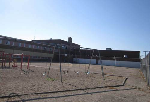 Large school building on 4 acres with 2 Gyms in Clarkfield, Minnesota. $109,000